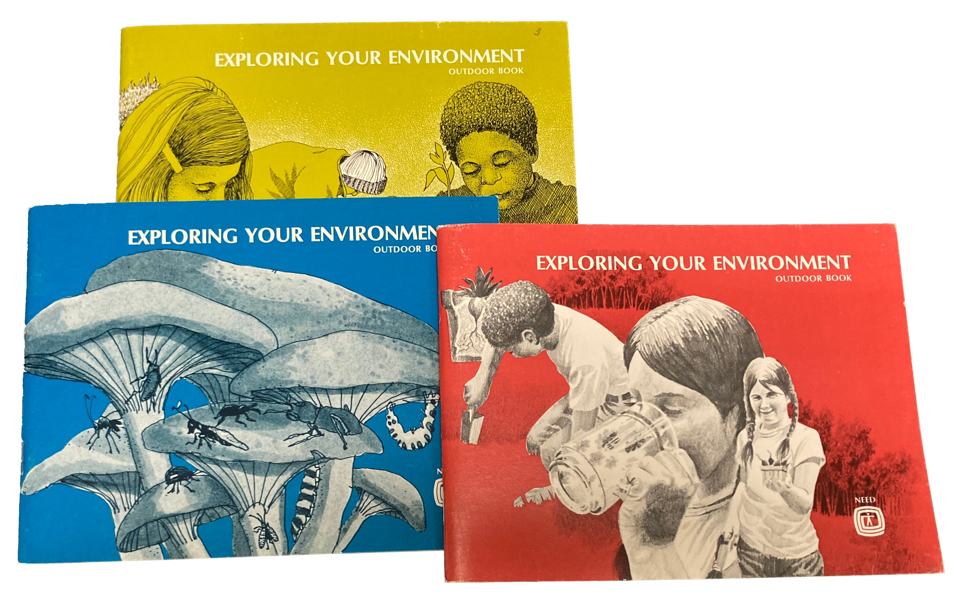Three brightly colored NEED handbooks