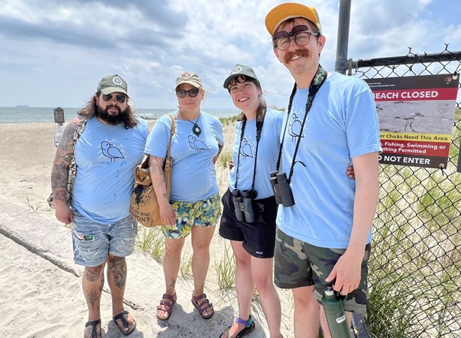 A group photo of volunteers standing next to each other at Gateway National Recreation Area.