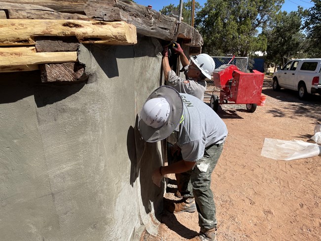 NPS Staff working on the walls of the historic Ranger Hogan NPS Staff working on the walls of the historic Ranger Hogan