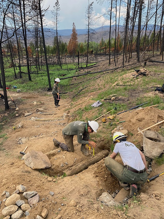 Replacing erosion control structures and tread stabilization features, such cribbing, log retaining structures and water bars along the Sun Valley Trail.