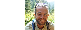 Nathan Kiel a smiling man with beard