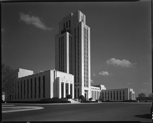 National Naval Medical Center Twenty-story stepped tower with strong vertical lines of stacked bay windows and a base of interconnected three and four-story pavilions. The building is reinforced concrete and structural steel, clad with quartz-faced concrete panels.