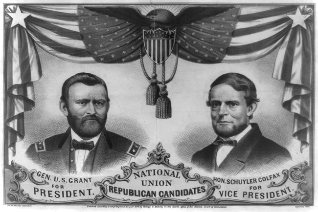 Black and white cartoon of Two men in suits on either side, with a flag banner around the top