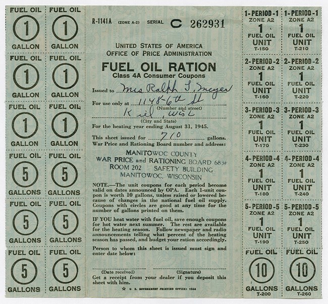 Left: 6 stamps with circles for 1 gallon each and 6 for 5 gallons each. Right: 10 stamps, 2 each for 1 fuel oil unit in Periods 1, 2, 3, 4, and 5. Plus two coupons with circles good for 10 gallons each. Form printed in black over green safety printing.