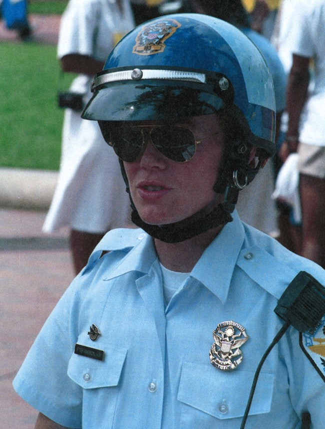 Motor Officer Kelcy Stefanson Kelcy Stefanson in wearing her motorcycle uniform and helmet.