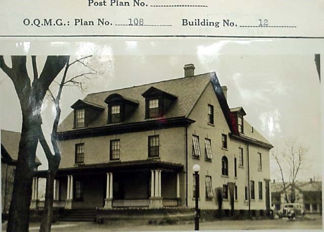 a two-story historic building with a porch