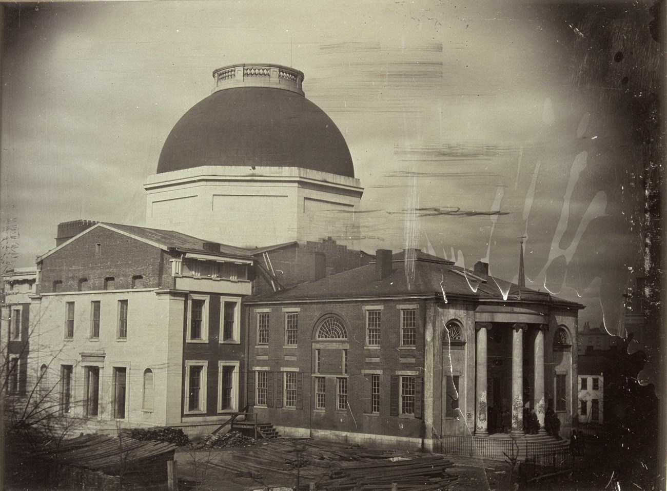 black and white photo of a courthouse under construction.