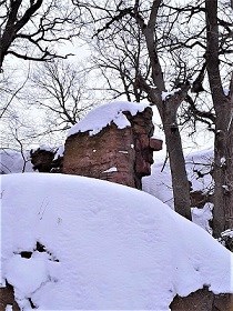 Old Stone Face in Winter Column of stone shaped like a face in snow