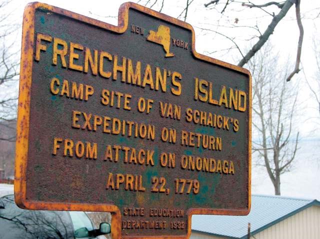 An old NYS historic marker: "Frenchman's Island. Camp site of Van Schaick's expedition on return on Onondaga. April 22, 1779"