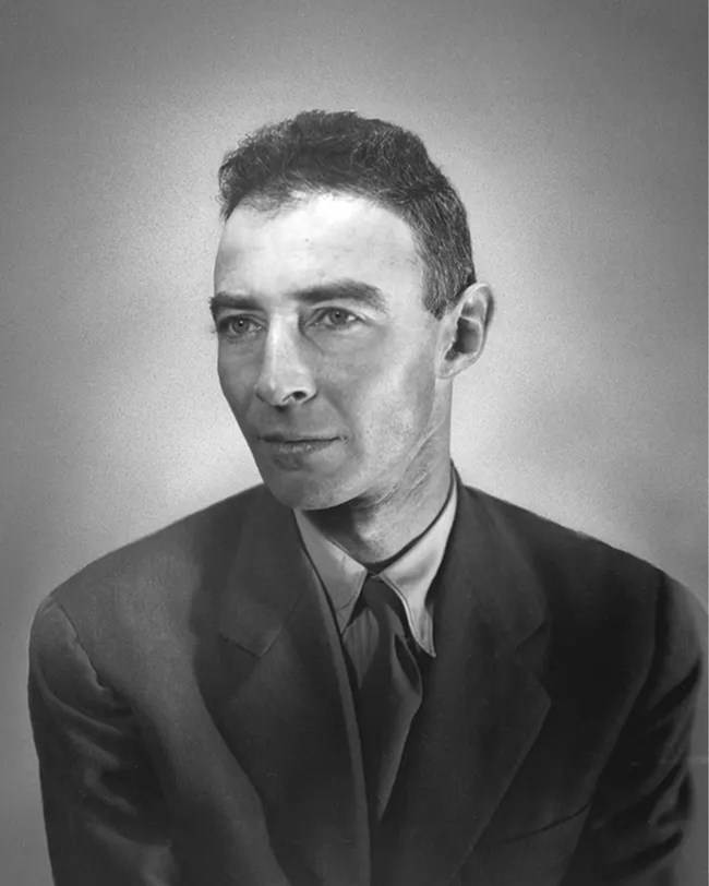 Black and white photo of Oppenheimer in a suit.