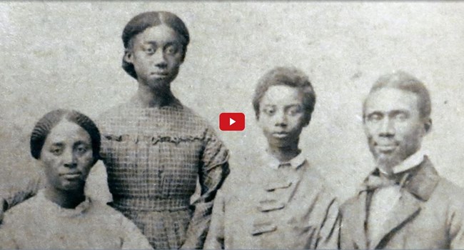 Screenshot of a video showing a historic portrait of a family