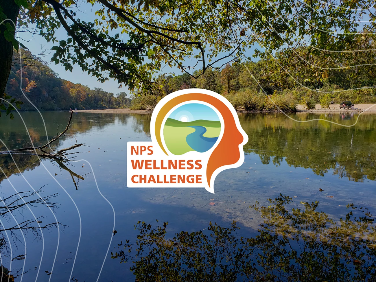 Ozark Scenic Riverways NPS Wellness Hero An orange graphic of a head in profile containing an image of a river winding through a landscape that says NPS Wellness Challenge in front of an image of a river scene of clear flowing water during the fall months with fall colors.