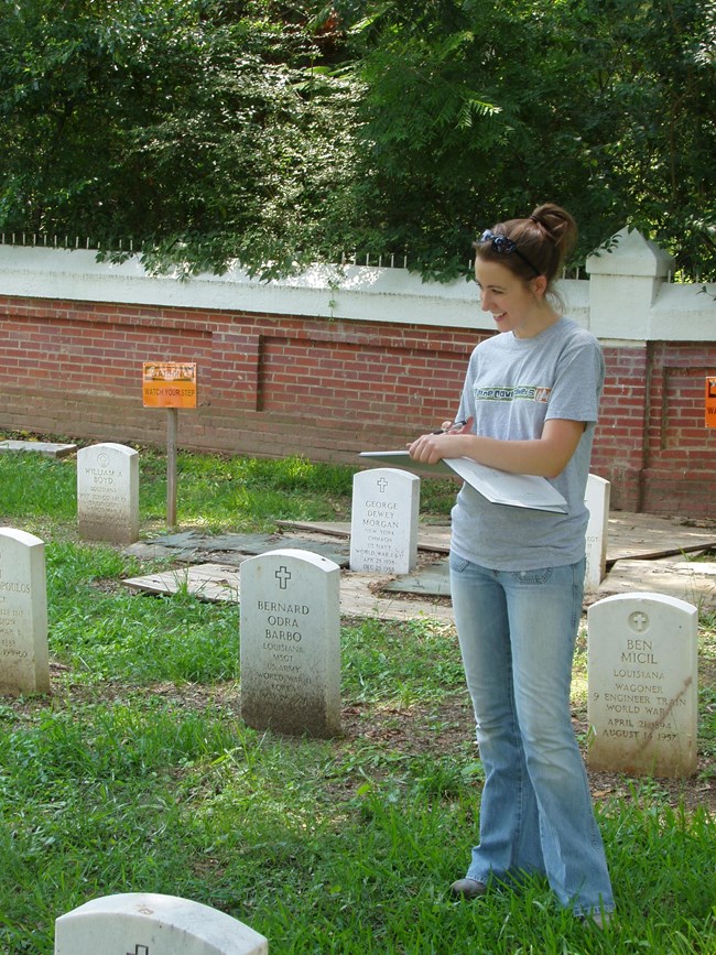 Megan as a 2005 intern, documenting graves in Pineville, LA.