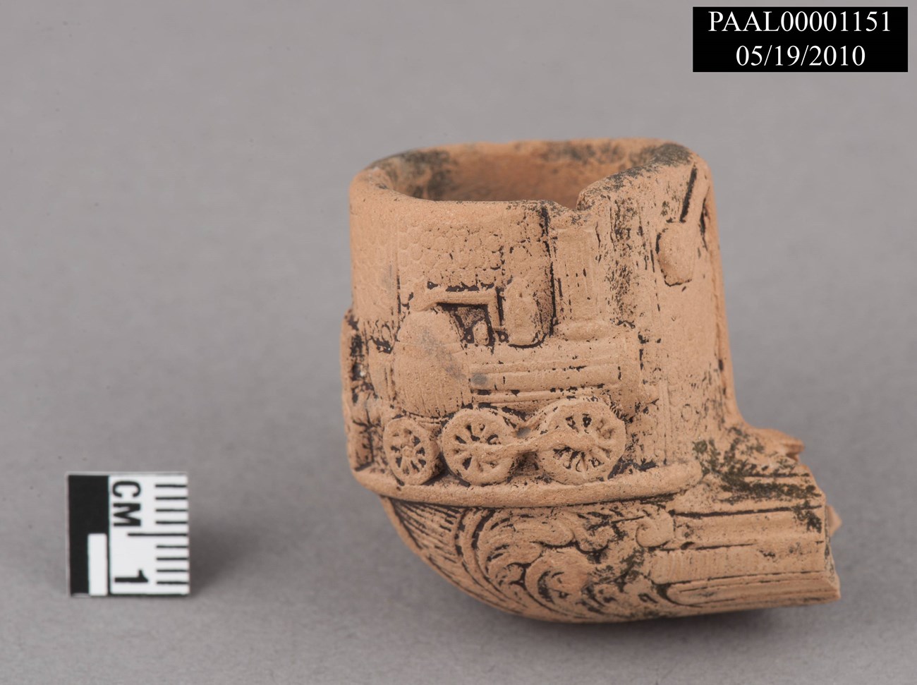 Clay pipe Clay pipe bowl with locomotive imprint.