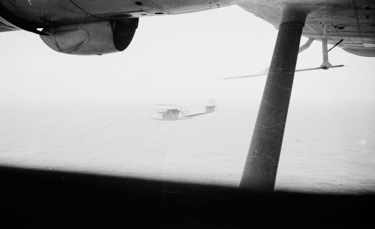 PBY flying in fog View from a plane to another plane flying in fog
