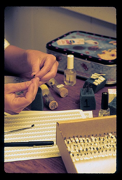 Pinnacles insect collection Person carefully handles inset specimen, inserting needle to preserve in museum collection.