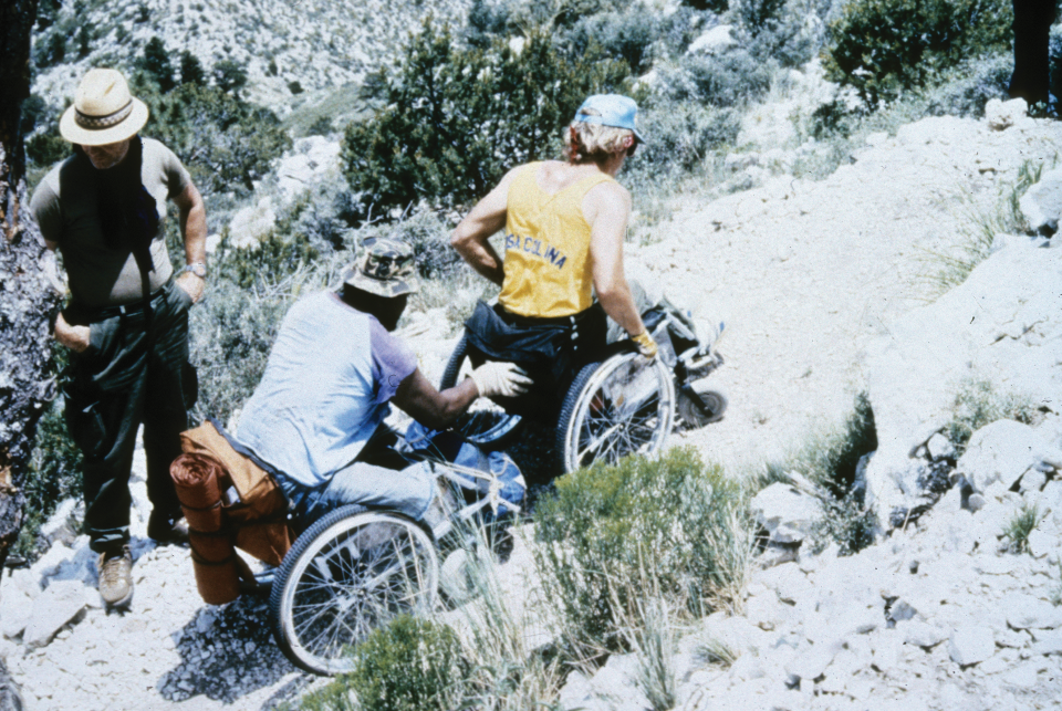 Men in wheelchairs ascend the Guadalupe peak trail