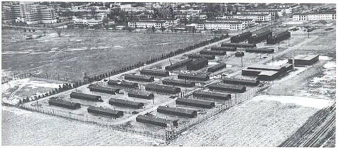 Black and white photo of a group of low buildings