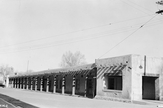 Palace of the Governors HABS NM LOC-113845pv exterior of a long, one story, adobe building. Library of Congress