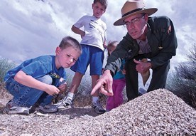 Park Ranger Robb Reinhart points out harvester ants to young participants at the Hymenoptera bioblitz in Great Basin National Park.