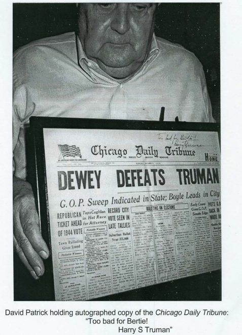 Father David Patrick Father David C. Patrick holding newspaper