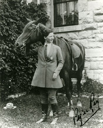 Lindsley and Rex the horse with a Stetson hat (which may have belonged to Ben Arnold) on the ground and the badge on her coat.