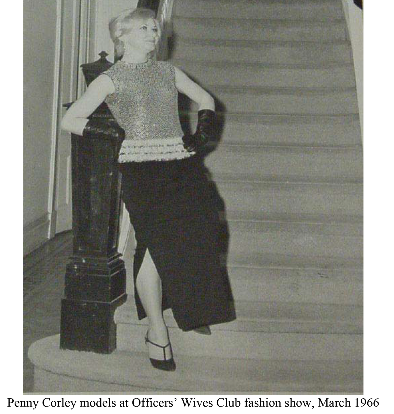 Woman in sequined dress on staircase