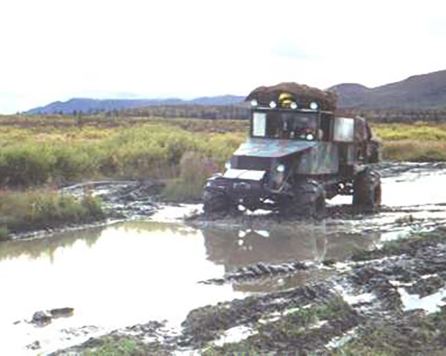 Photo 5 4X4 ATV Talkeetna Mts (Kevin Meyer NPS)_crop_web An ATV in the mud.