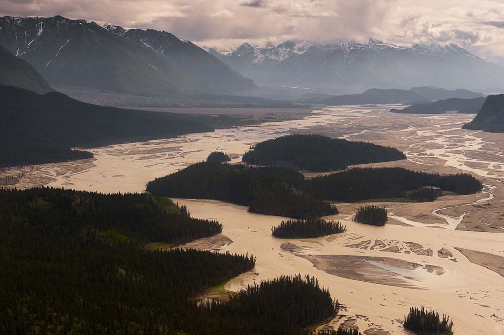 A braided river between mountains.