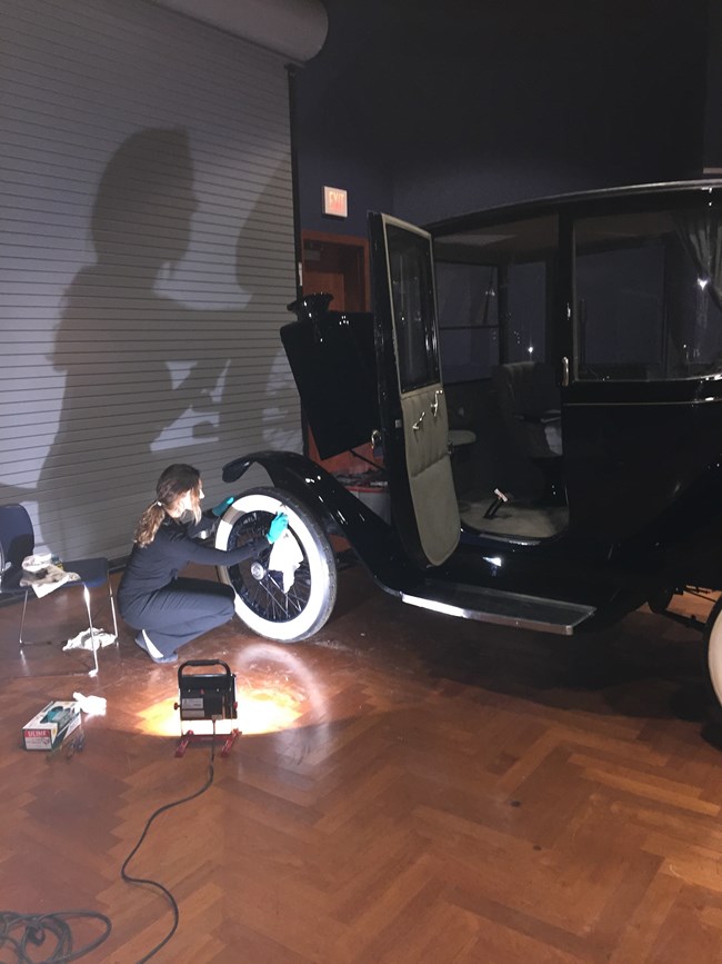 Cleaning the Whitewall Tires of the 1922 Detroit Electric Coupe Before Exhibition Cleaning the Whitewall Tires of the 1922 Detroit Electric Coupe Before Exhibition