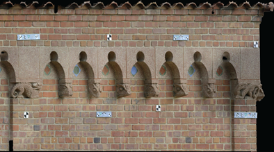 Photogrammetric Facade Color photogrammetric rendering of a several sculptural elements on the façade of the Reptile House with several black and white targets and long color rectangular scale bars temporarily attached to a brick wall.