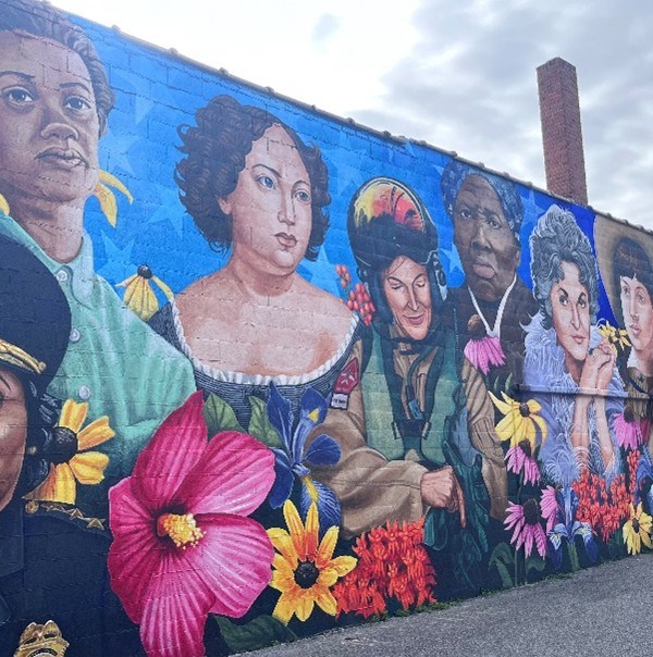 Image of the Dorchester Women's Mural located in Downtown Cambridge, MD. The mural features a dozen women from the past and present who have made a difference in Dorchester County and far beyond. Image of the Dorchester Women's Mural located in Downtown Cambridge, MD. The mural features a dozen women from the past and present who have made a difference in Dorchester County and far beyond.