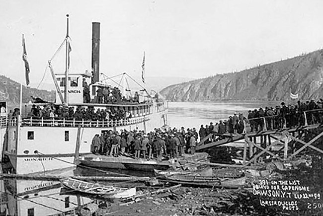 Picture6_web Historical image of men boarding a steamership.