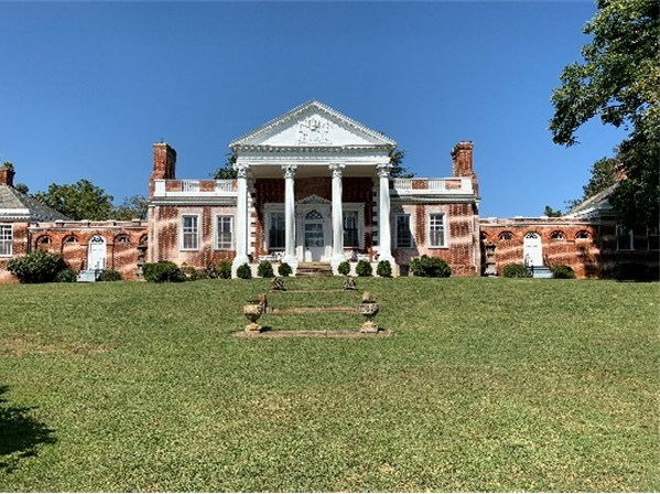 Image of the front view of the Estate House located at the Whitehall site on a clear, sunny day. Image of the front view of the Estate House located at the Whitehall site on a clear, sunny day.