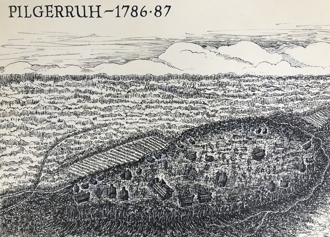 Pen and ink drawing of an aerial view of a village on a plateau surrounded by forest; the village is two dozen scattered wooden buildings including a chapel; text at top reads, "Pilgerruh - 1786-87."