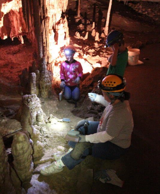 Volunteers find the real cave floor in  the Inscription Room, buried under sand.