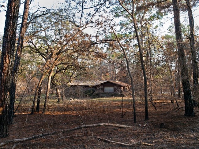 CCC structures in Bastrop State Park such as this cabin were threatened by a dangerous wildfire in 2011. CCC structures in Bastrop State Park such as this cabin were threatened by a dangerous wildfire in 2011.