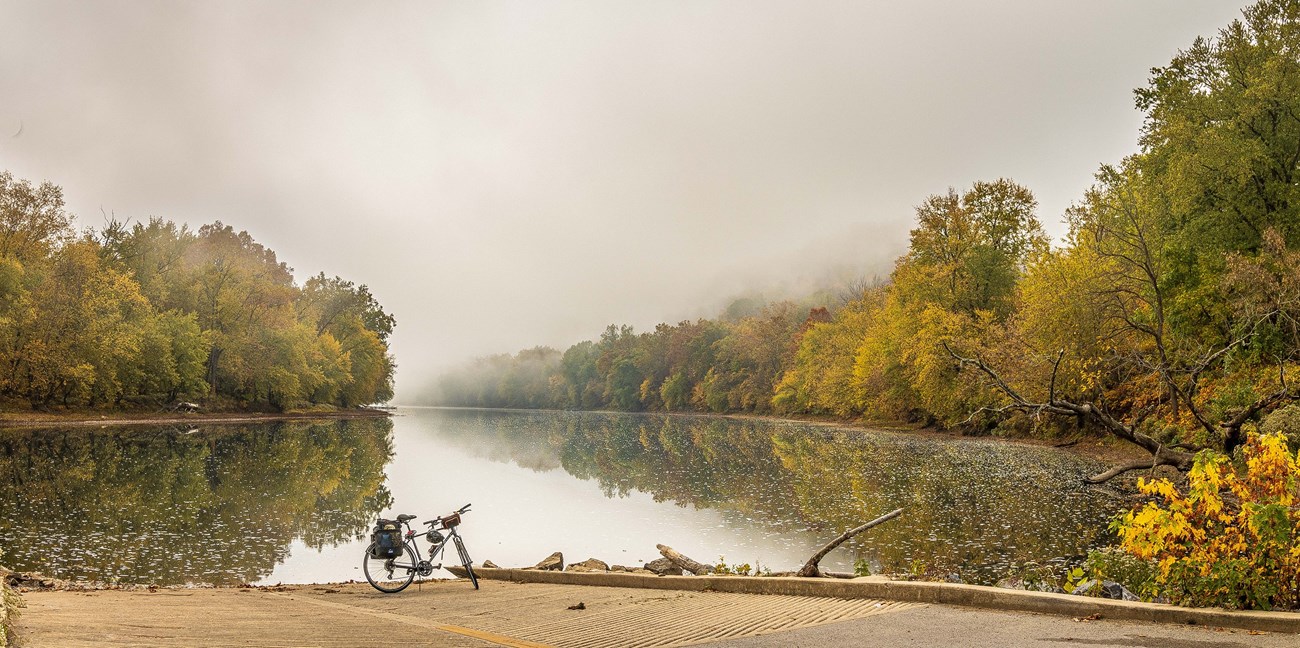 Bike sitting in front of the Potomac River in the fall.