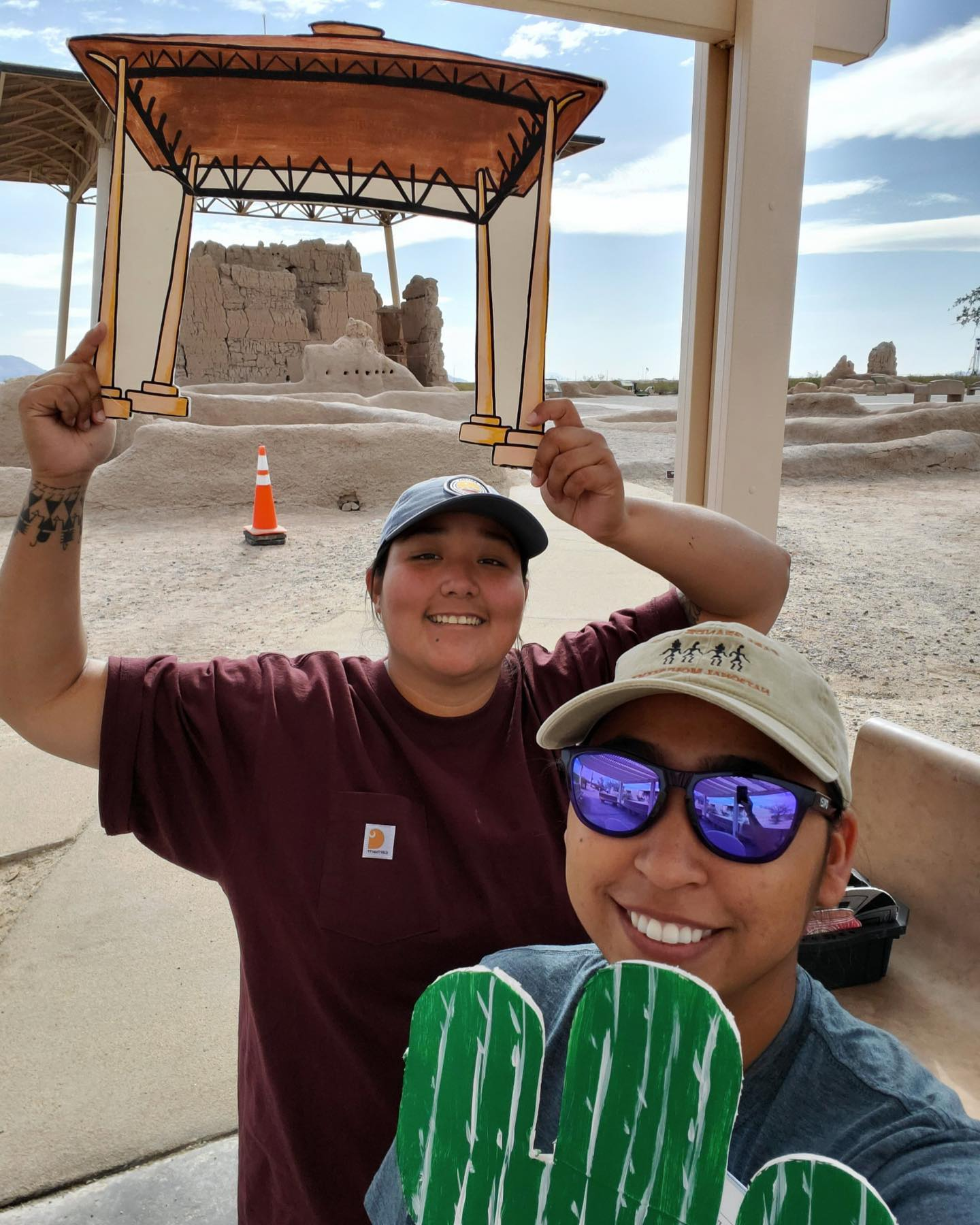 Precious Vicente and a park staff posing in front of the Great House Precious Vicente and a park staff posing in front of the Great House