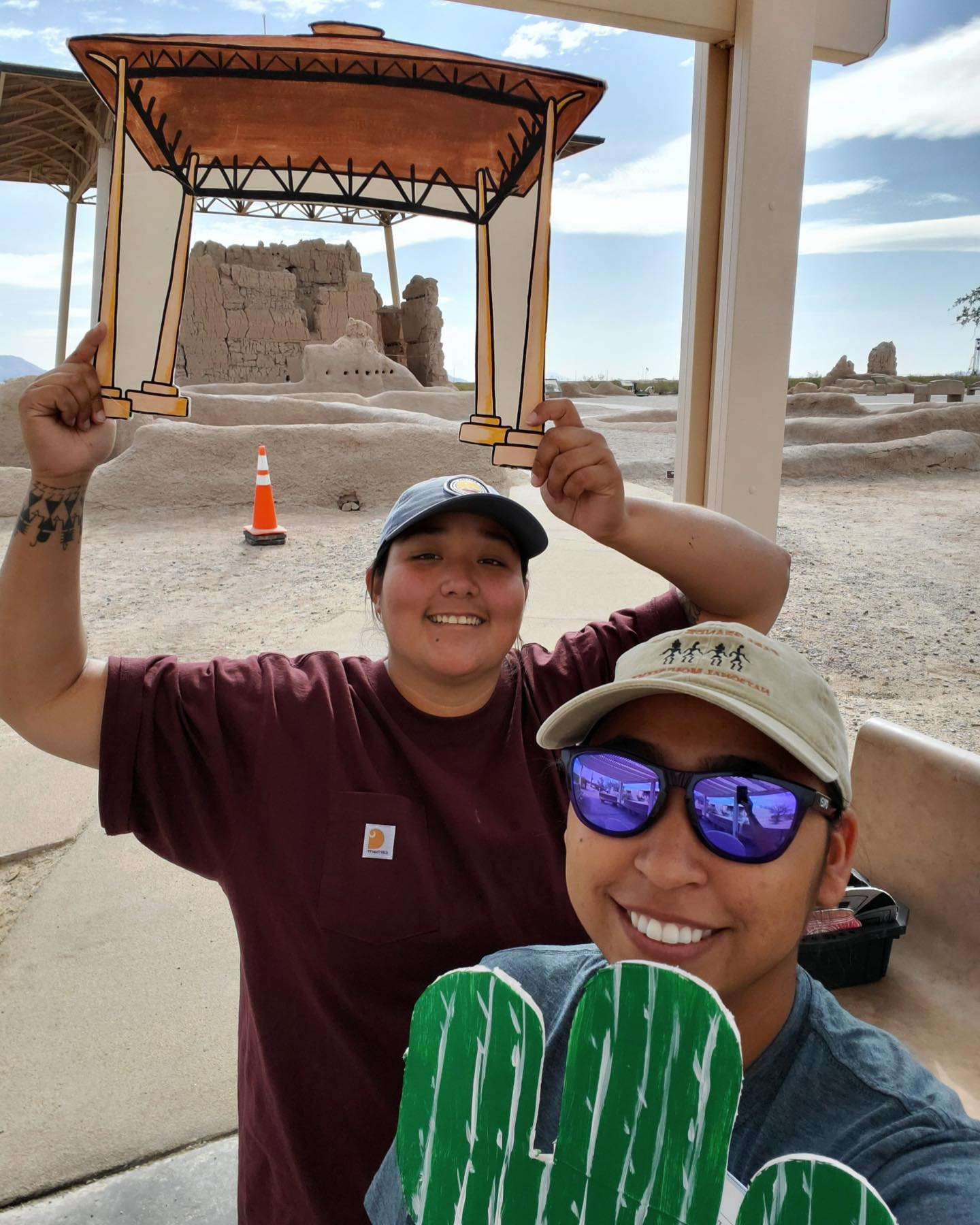 Precious Vicente and a park staff posing in front of the Great House