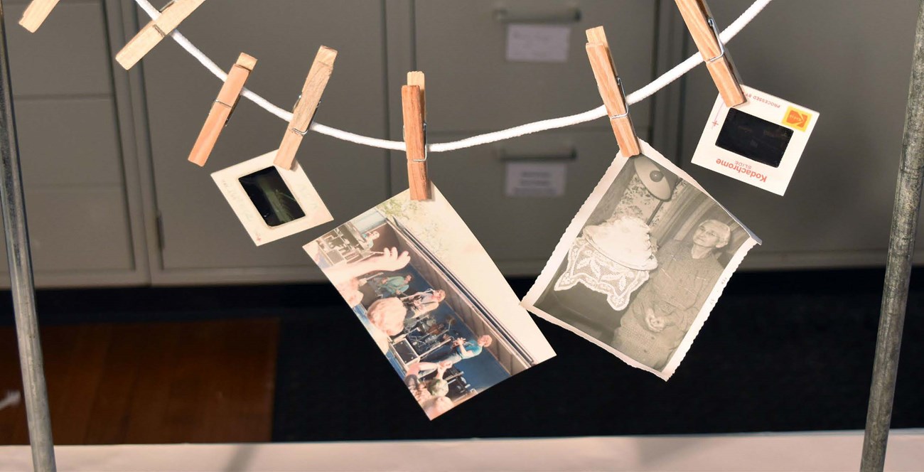 The cover photo shows several wet photographs clipped to a clotheslines using clothespin to allow the photographs to hang dry.