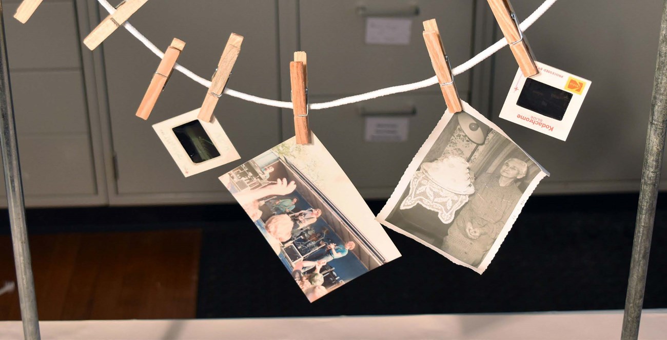 The cover photo shows several wet photographs clipped to a clotheslines using clothespin to allow the photographs to hang dry. The cover photo shows several wet photographs clipped to a clotheslines using clothespin to allow the photographs to hang dry.