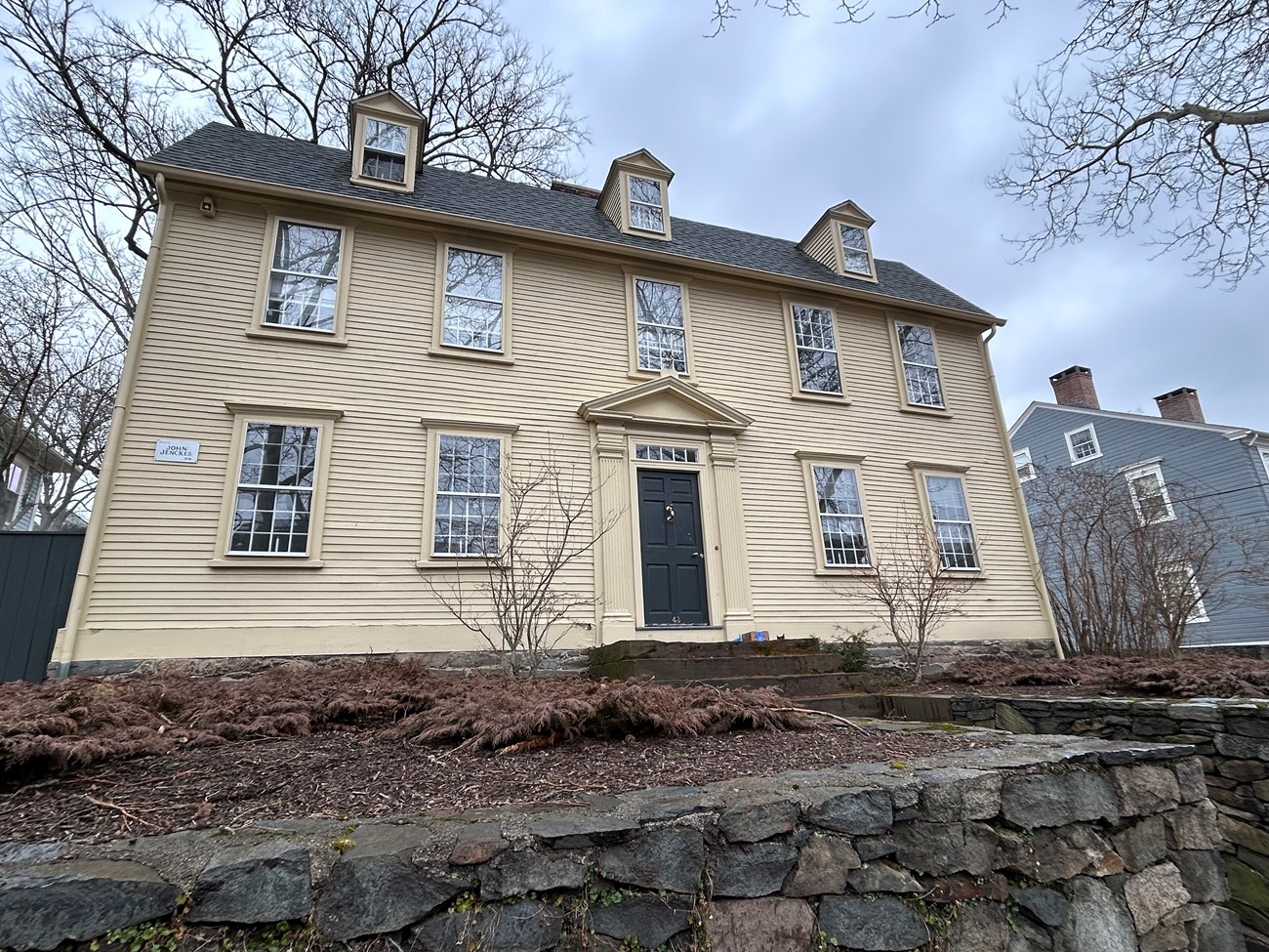 Yellow 2 story colonial house