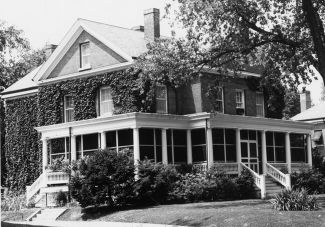 Quarters #7 A black and white image of a house