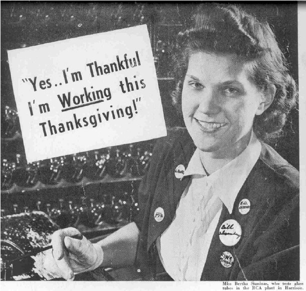 A young woman smiling. Text. Yes... I'm thankful I'm working this Thanksgiving!