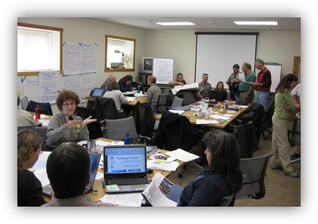 A group of national park service managers planning in a conference room