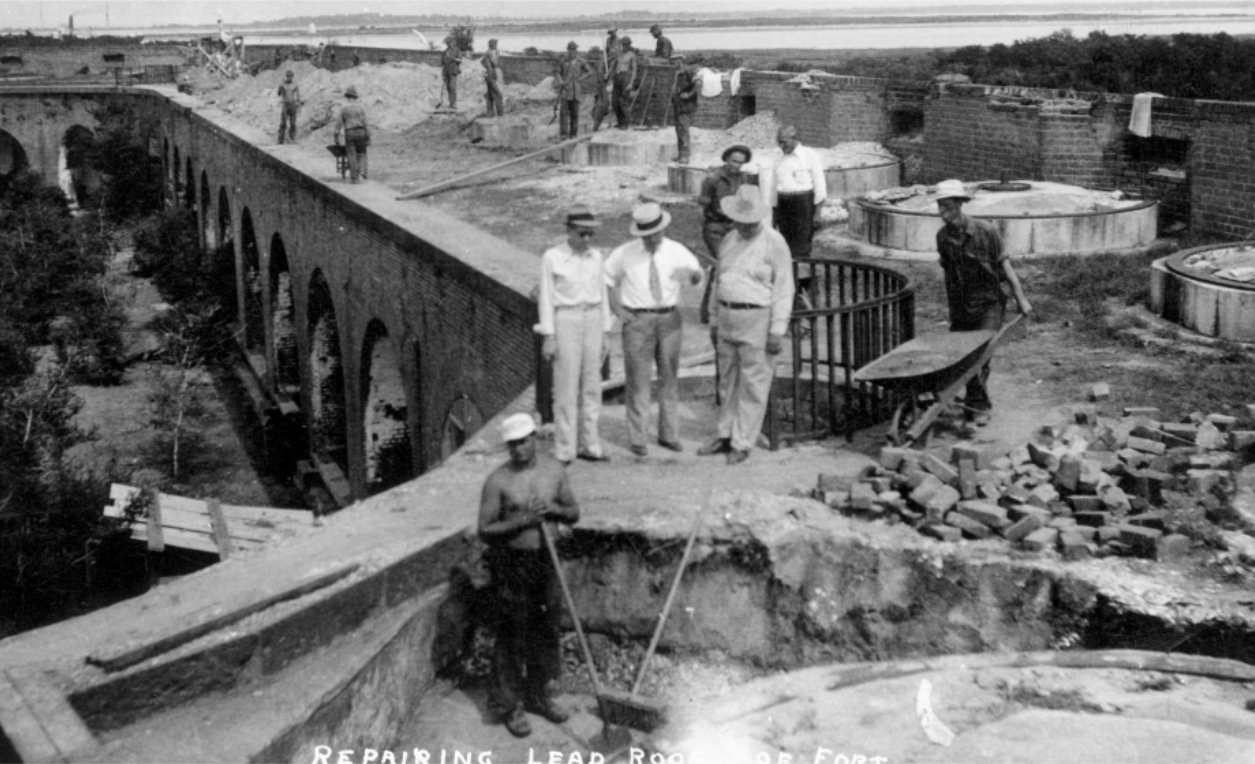 Repairing terreplein Men standing around excavated terreplein