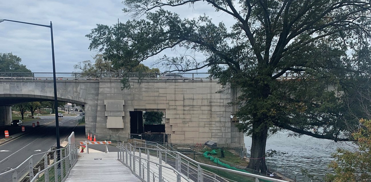 Bike trail next to a road that leads to a tunnel