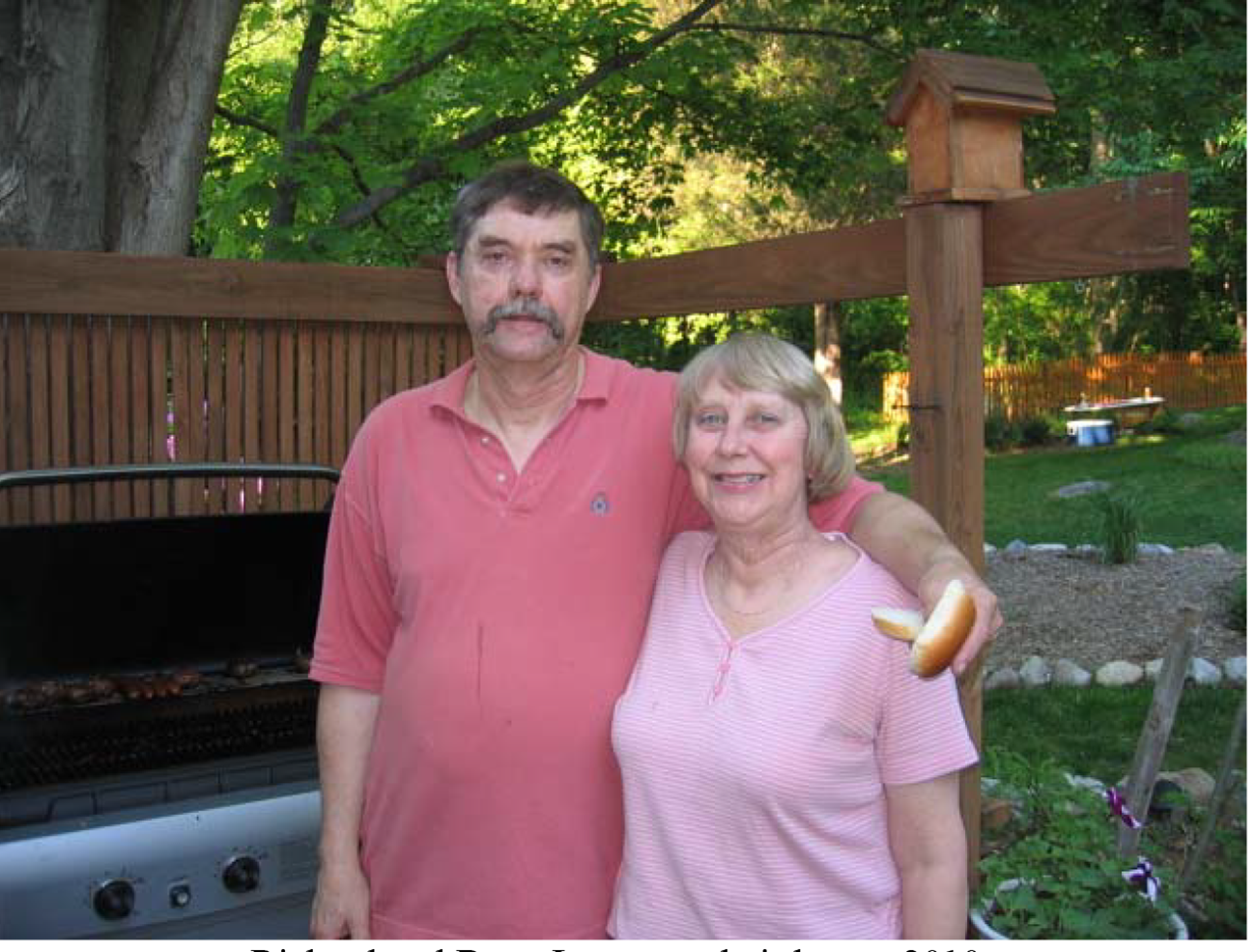 Couple standing in front of house
