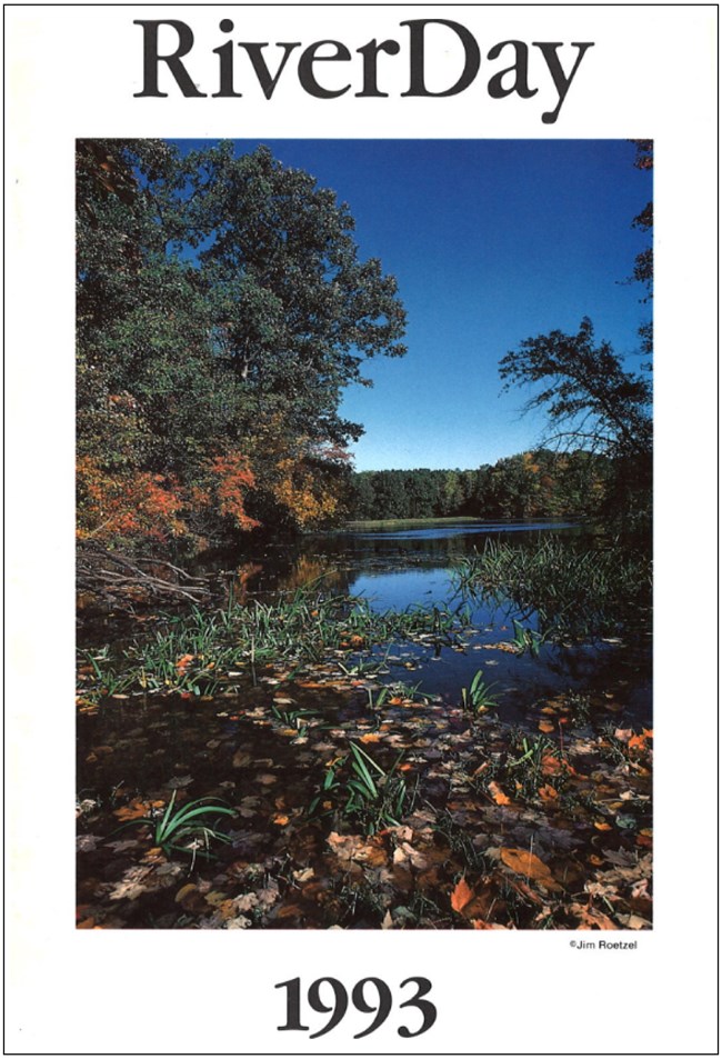 White booklet with black text reading "RiverDay 1993" with a photo of a forested river under a blue sky.